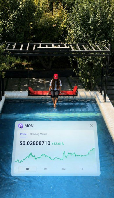 A person in a red cap standing on a swing over a pool, with an overlay showing MON cryptocurrency price at $0.02808710, up 12.61%, with a green chart.