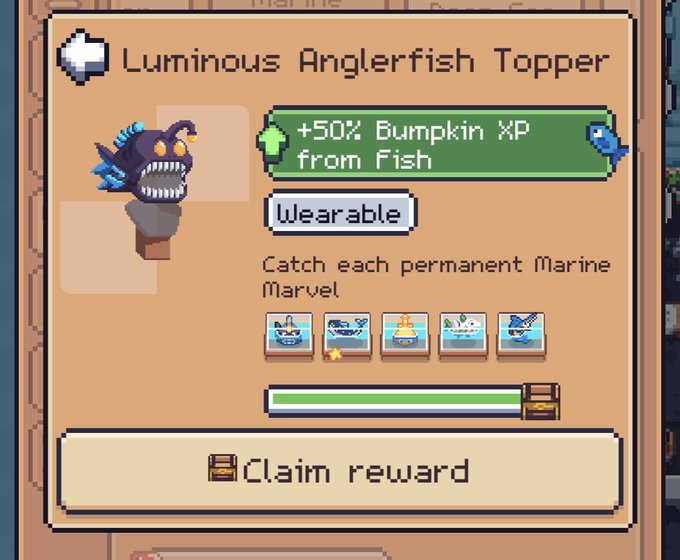 A video game interface showing a 'Luminous Anglerfish Topper' reward that grants '+50% Bumpkin XP from Fish' upon completing the 'Catch each permanent Marine Marvel' challenge.