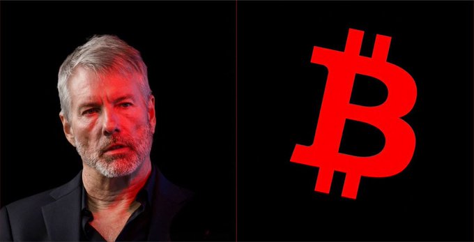 Michael Saylor is shown next to a large red Bitcoin logo on a black background, his face illuminated with red light.