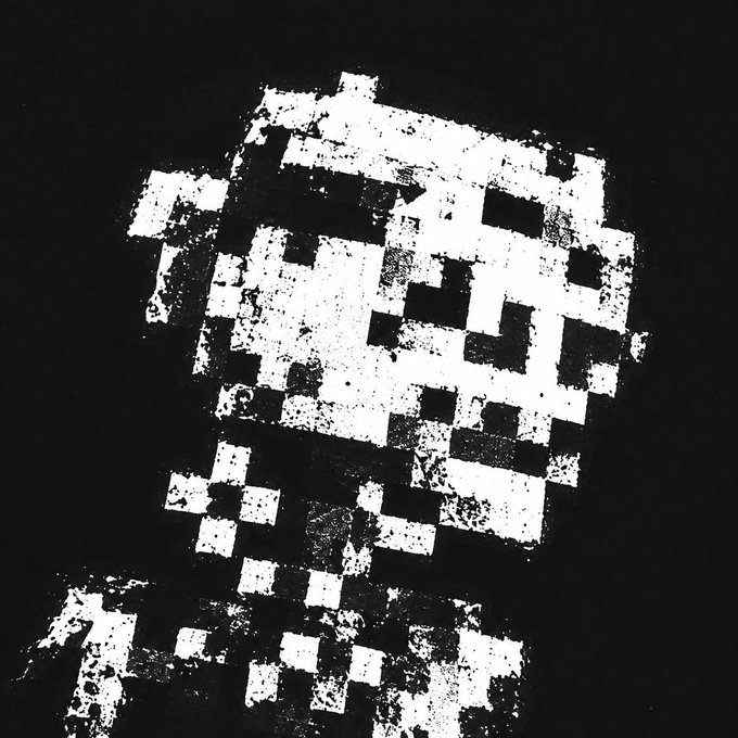 A pixelated black and white image showing a blocky, low-resolution face with dark square eyes.