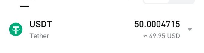 The image shows a wallet balance displaying **50.0004715 USDT** (≈49.95 USD) from Tether, representing a small crypto reward received from Bitget_TradFi for a single post—aligning with the caption's sentiment that the payout isn't much, but is still meaningful.