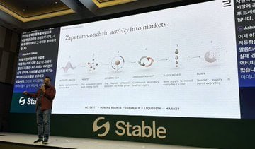 A man presenting in front of a large screen displaying 'Zaps turns onchain activity into markets' for Stable, with visible navigation categories including Activity, Incoming Assets, Insurances, Liquidity, and Market.