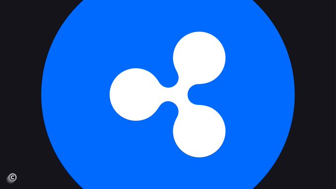 The image shows the Ripple (XRP) logo, featuring its distinctive white three-bladed propeller design on a blue circular background, which visually represents the company that just received full MiCA approval to offer crypto services across Europe.