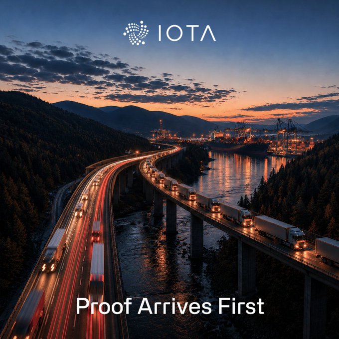 The image shows a twilight aerial view of trucks traveling along a highway bridge toward an illuminated port, with the IOTA logo at the top and the tagline "Proof Arrives First" at the bottom. The scene visually reinforces the post's message about supply chain efficiency—showing cargo in transit on the road while a busy port waits ahead, illustrating how verified documentation (the "proof") can outpace the physical goods and enable faster financing decisions.