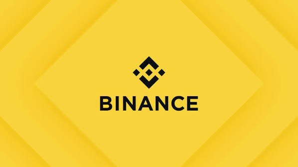 The image displays the Binance logo and name on a yellow background. It relates to the post by representing the crypto exchange context, visually anchoring the discussion about crypto market cycles, price volatility, and trading strategy with the brand associated with cryptocurrency trading.