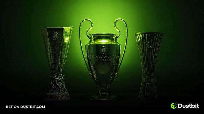 Three ornate silver trophies of varying designs are illuminated against a dark green gradient background, with 'BET ON DUSTBIT.COM' and the Dustbit logo displayed in the bottom corners.
