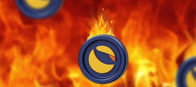A Terra Classic (LUNC) coin emblem engulfed in flames, symbolizing the community's push to burn 99% of the LUNC token supply.