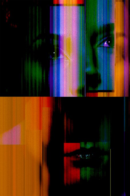 A heavily glitched, colorful abstract image featuring distorted vertical color bars obscuring a faint human face.