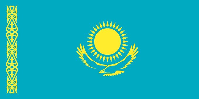 The image displays the flag of Kazakhstan, featuring its iconic sky-blue background, golden sun with rays, soaring steppe eagle, and ornamental left-side border. The flag symbolizes the country mentioned in the post, which is exploring the use of flared gas from oil fields to power Bitcoin mining operations.