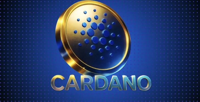 A stylized 3D rendering of a gold coin featuring the Cardano logo—an arrangement of blue dots in a circular pattern—set against a dark blue dotted background, with the word "CARDANO" displayed in metallic gold lettering beneath it.