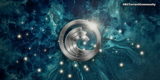 The image features the metallic BitTorrent (BTT) logo centered against a swirling cosmic background of teal and dark blue, with the hashtag "#BitTorrentCommunity" displayed in the upper right corner, visually reinforcing the post's message about BitTorrent's established legacy and grassroots community roots predating its token.