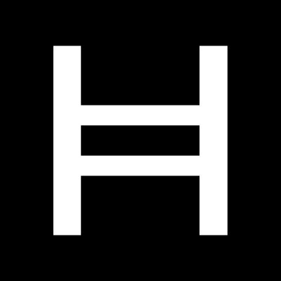 The image features a white "h" symbol, which appears to be a logo or design element. The "h" is composed of two vertical lines intersecting at the center, creating a unique and recognizable pattern. This design could potentially represent a specific brand or company name, as it has been described that it's a "pattern in technology". The image also includes text that reads: "There is a pattern in technology that repeats itself so reliably it almost feels like a law. Infrastructure gets built first. The world notices years later. Every single time." This text provides context to the design and its significance, suggesting that the "h" symbol might be associated with a particular brand or industry.