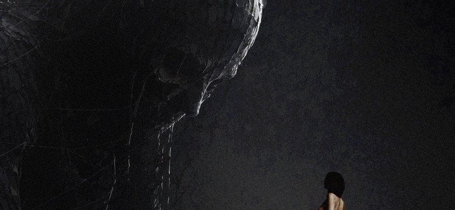 A dark, atmospheric image showing a person with short dark hair standing at the bottom right, looking up at a massive shadowy figure against a textured black background.