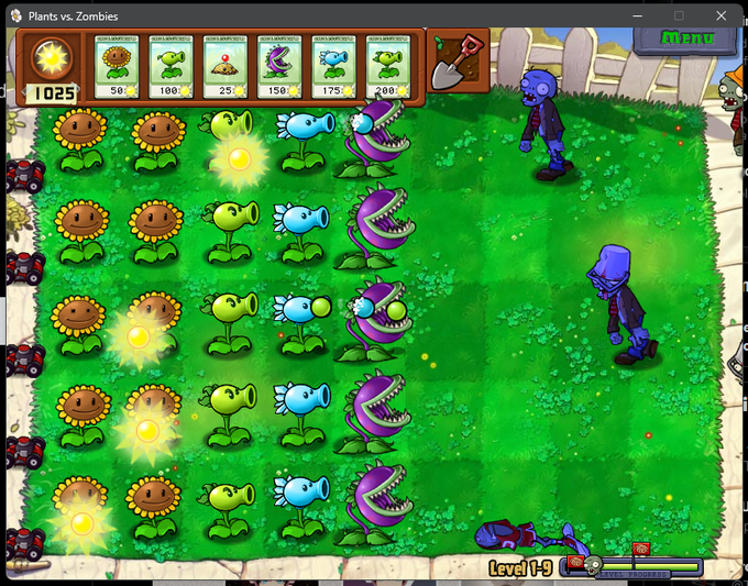A screenshot of the Plants vs. Zombies video game showing Level 1-9, with rows of sunflowers, peashooters, and chomper plants defending against approaching zombies on a lawn.