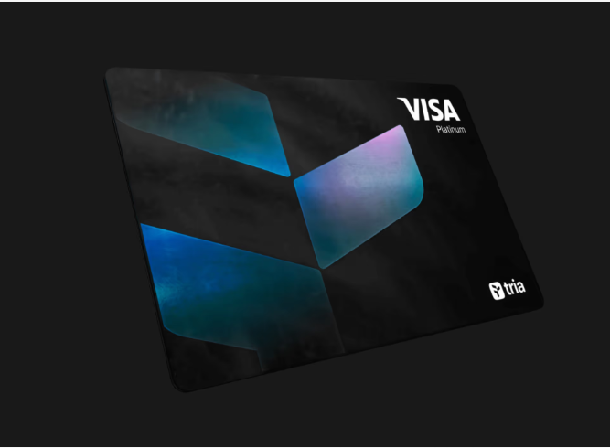 The image features a black Visa card with a blue design, which appears to be a self-custodial card that works everywhere. The card has a unique design featuring three blue triangles arranged in a triangular pattern. The text on the card reads "Visa" and "Self Custodial", indicating its purpose as a self-custodial card. The post also mentions that the card is designed to be used worldwide, which implies that it can be used by people from different countries without any issues. Additionally, the image includes a code for a website called "@useTria" and a link to a post on social media platforms like Twitter or Instagram.