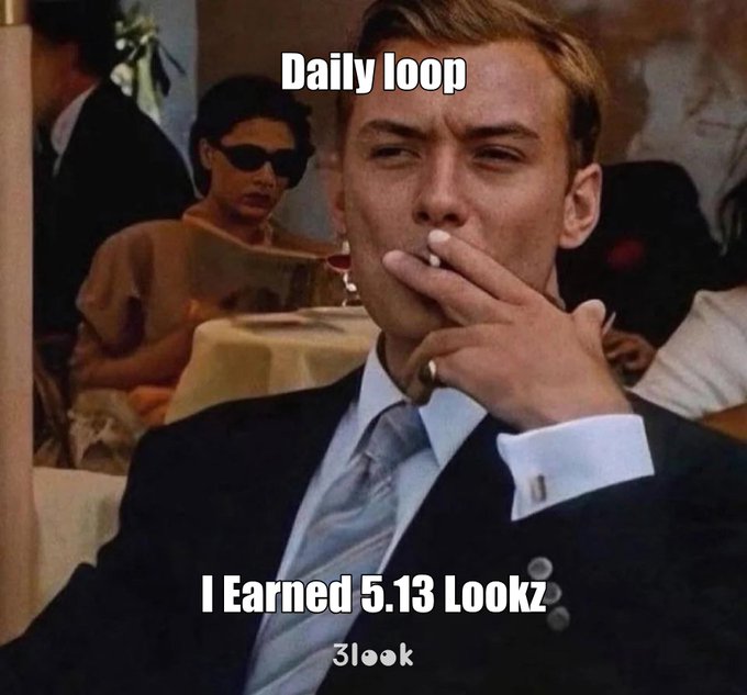 The image features a man wearing a suit and tie smoking a cigarette while sitting at a table with other people around him. The caption of the image reads "Daily Loop I Earned 5.13 Looks", which seems to be a reference to the post about the man's looks on social media.