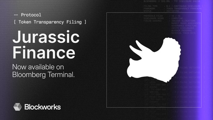 A promotional graphic announces Jurassic Finance's availability on Bloomberg Terminal, featuring the text "-- Protocol [ Token Transparency Filing ]" alongside the Blockworks logo. The image relates to the post by visually highlighting the $RAWR token transparency filing through a code-styled background and a triceratops silhouette logo against a dark backdrop.