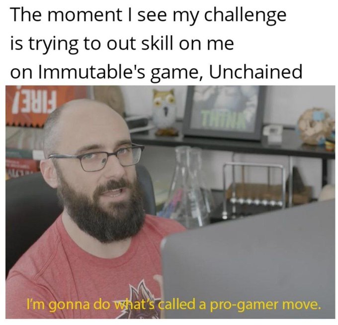 The image features a man wearing glasses sitting at a desk with a laptop computer open in front of him. The text above his head reads, "The moment I see my challenge is trying to out skill on me on Immutable's game. Unchained". This statement seems to be related to the game he is playing or discussing.