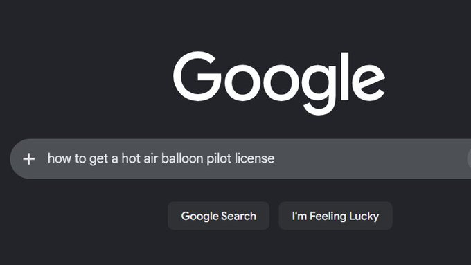 Google search homepage with the query 'how to get a hot air balloon pilot license' typed in the search bar.
