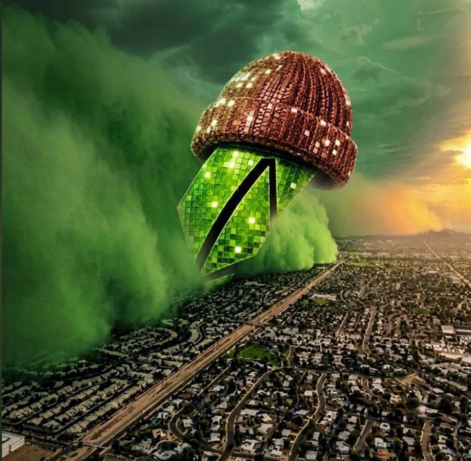 A surreal composite image showing a large disco ball wearing a brown knit beanie falling toward a suburban cityscape, with green smoke billowing around a green geometric shape.