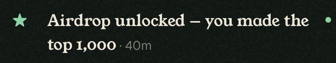 A notification banner with a green star icon reading 'Airdrop unlocked – you made the top 1,000 · 40m' on a dark background.