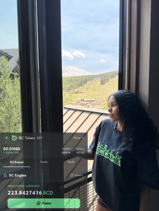 A woman with long dark hair stands by a window looking out at a mountain landscape, wearing a black Blocktime t-shirt, with a BC Token $BC crypto interface showing 223.8427416 BCD unclaimed earnings overlaid on the image.