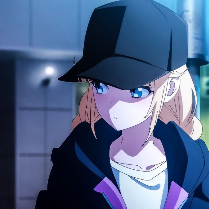 An anime-style illustration of a blonde girl with blue eyes wearing a black cap pulled low, a face mask, and a dark hoodie.