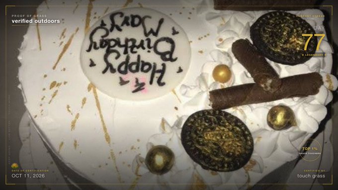 An overhead view of a white frosted birthday cake decorated with gold accents, Oreo cookies, Ferrero Rocher chocolates, and chocolate sticks, with handwritten 'Happy Birthday' text and overlaid digital UI text including 'DAY 77' and 'OCT 11, 2026'.