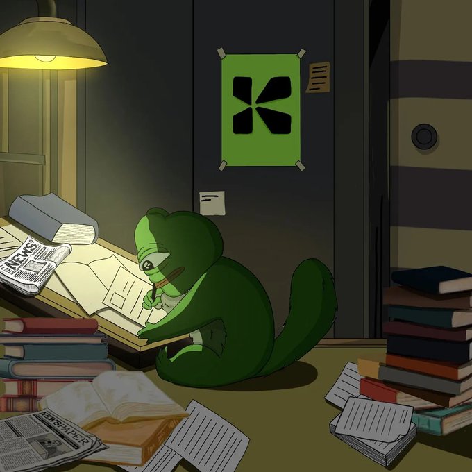 An illustration of a green bear character sitting on the floor, writing in a book surrounded by stacks of books and papers, with a green K-shaped poster on the wall.