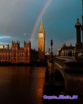 A scenic photograph of Big Ben and Westminster at dusk with a rainbow in the sky, watermarked 'Crypto_illwhale_01'.