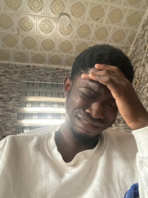 A young man in a white shirt holds his hand to his forehead, eyes closed and face scrunched in apparent distress or frustration. The image accompanies a post about "$SUI" on "Day 28 Of June 2026," likely expressing emotional reaction to the cryptocurrency's performance or news.