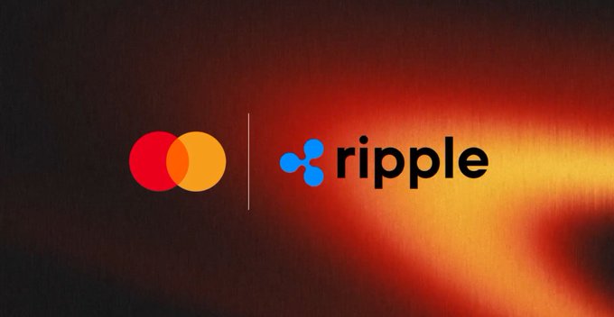 The image features a logo for Mastercard and Ripple, both of which are logos that appear to be floating against a dark background. The logos are positioned side by side with their colors contrasting against each other - one being red and the other blue. The text "Mastercard" is written in white letters below the logos, while "Ripple" is written in black letters above them. This arrangement suggests that these two companies might be collaborating or associated with each other in some way.