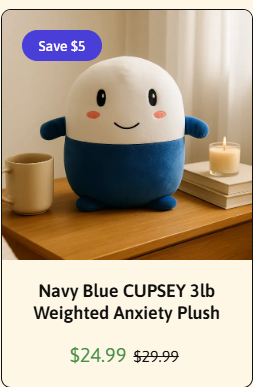 A $24.99 (marked down from $29.99) Navy Blue CUPSEY 3lb Weighted Anxiety Plush is shown on a table next to a mug and candle, featuring a white and navy blue egg-shaped character with a smiling face. The image showcases the cute Cupsey plushie mentioned in the post as a decorative purchase, with the "Save $5" badge highlighting the current deal.