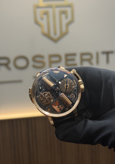 A gloved hand displays a luxurious skeleton-dial watch with gold accents in front of a "PROSPERITY" branded backdrop, humorously symbolizing the speculative "prosperity" that meme coin traders chase with their morning prayers for gains.