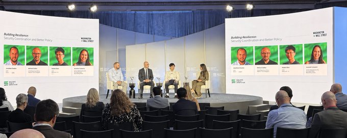 A panel discussion titled "Building Resilience: Security Coordination and Better Policy" hosted by the Solana Institute, featuring speakers including Amanda Fischer, Jonathan Cody, and Jordan (last name unclear), takes place on stage before an audience, as referenced in the accompanying post about security coordination informing smarter policymaking.