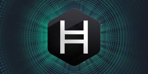 The image features the Hedera (HBAR) logo—a black hexagon with a white "H"—set against a dark, glowing teal background with a digital radial pattern. It visually underscores the post's point about Lloyds Banking Group adopting Hedera's blockchain for real-world foreign exchange collateral transactions, highlighting the project's growing legitimacy in traditional finance.