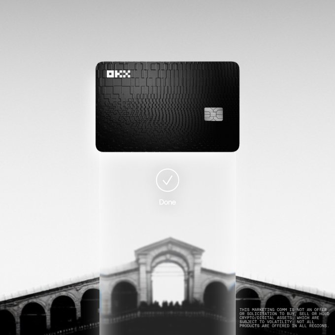 Advertisement showing a black OKX branded bank card with a circuit-board pattern design, featuring a 'Done' checkmark and a bridge in the background.