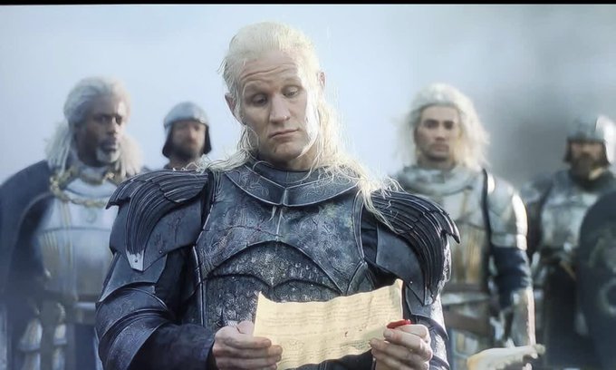 A pale-haired figure in elaborate silver armor reads a letter with a deeply disappointed expression, flanked by other armored soldiers. The image humorously illustrates the post by portraying the somber reaction of Ronaldo fans whose Polymarket bets on Portugal winning the tournament appear to have failed.