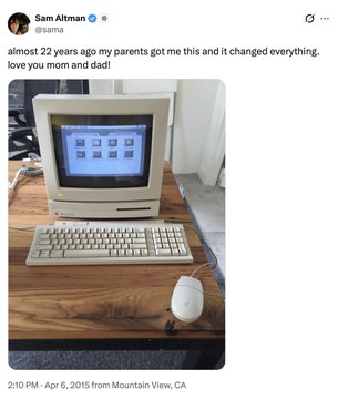 The screenshot shows a tweet from Sam Altman (@sama) posted on April 6, 2015, reading "almost 22 years ago my parents got me this and it changed everything. love you mom and dad!" alongside a photo of a vintage Apple Macintosh Classic computer with keyboard and mouse on a wooden desk. The image serves as a nostalgic reminder that today's feared technologies—AI in this case—were once revolutionary new tools that transformed lives, mirroring how personal computers were once viewed with skepticism by schools just as AI is being banned by New York.