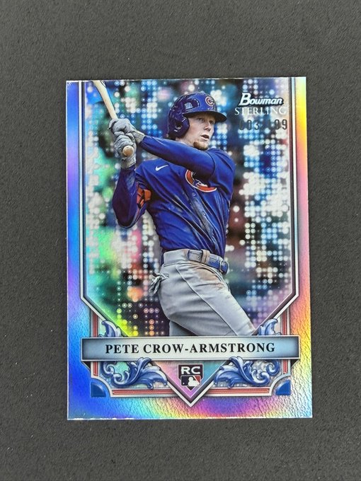 A 2023 Bowman Sterling Rookie Card (RC) of Chicago Cubs player Pete Crow-Armstrong with a holographic refractor design showing him mid-swing.