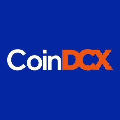 A simple CoinDCX logo appears on a solid blue background, with “Coin” in white and “DCX” in orange.