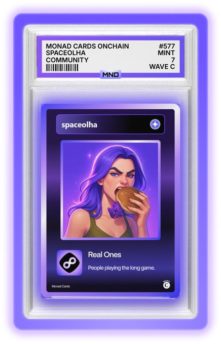 A purple-bordered collectible card labeled 'MONAD CARDS ONCHAIN' for 'SPACEOLHA COMMUNITY' (#577, MINT 7, WAVE C), featuring an illustration of a purple-haired woman eating a sandwich with the text 'Real Ones - People playing the long game.'