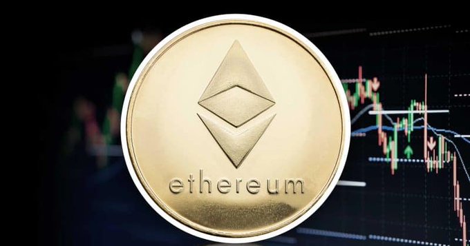 A gold Ethereum coin displays the diamond-shaped logo and "ethereum" text, set against a blurred candlestick chart showing price volatility. The image visually reinforces the article's message about record ETH staking levels—nearly 40 million tokens locked in the network—against a backdrop of fluctuating market conditions.
