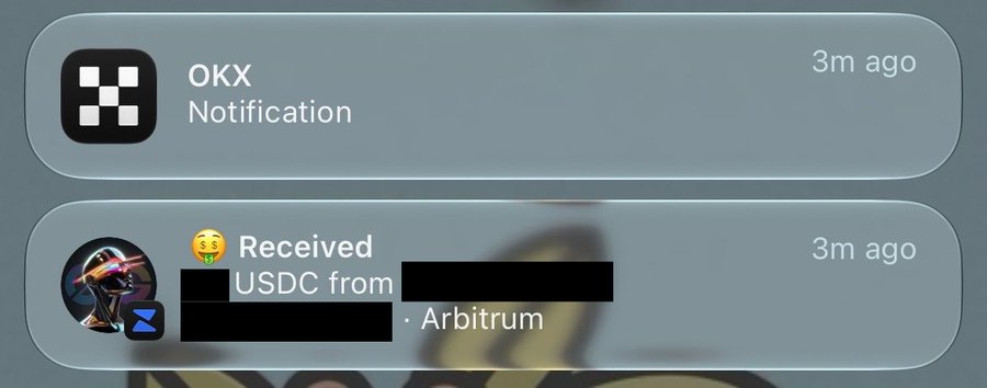 Two OKX notifications on a mobile device, with the second showing a USDC receipt from a redacted sender via Arbitrum network, both timestamped 3m ago.
