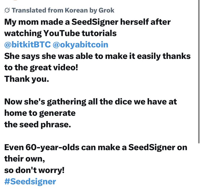 The image is a translated screenshot of a post sharing that the author's mom successfully built her own SeedSigner by following YouTube tutorials from @bitkitBTC and @okyabitcoin, and is now gathering dice at home to generate her seed phrase, proving that even 60-year-olds can do it.