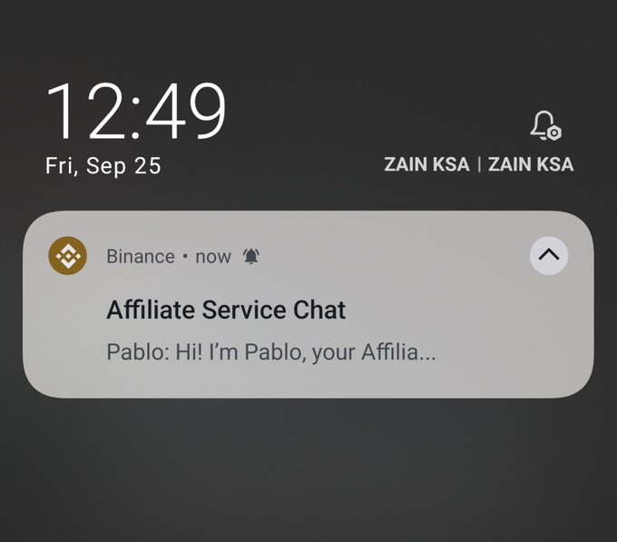 A smartphone lock screen showing the time '12:49' on 'Fri, Sep 25' with carrier 'ZAIN KSA | ZAIN KSA' and a Binance notification for 'Affiliate Service Chat' from Pablo.