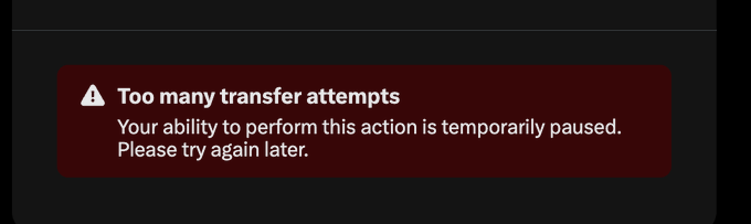 A dark error notification with a warning triangle icon displays 'Too many transfer attempts' with the message 'Your ability to perform this action is temporarily paused. Please try again later.'