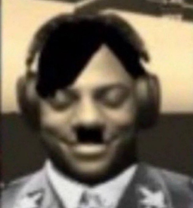 A grainy, vintage-style image of a man with a mustache wearing a Hitler-style mustache, with distorted facial features suggesting a deepfake or AI-manipulated photograph.