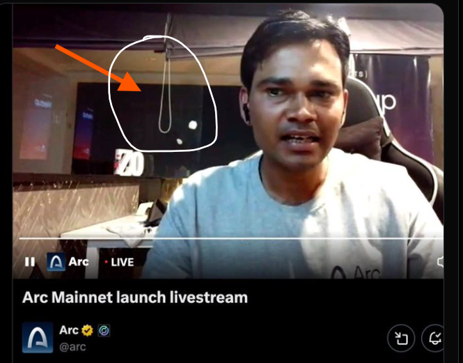 A screenshot of an X/Twitter live stream titled 'Arc Mainnet launch livestream' by @arc shows a man in a gray shirt with an orange arrow and white circle highlighting a noose-like object hanging in the background.