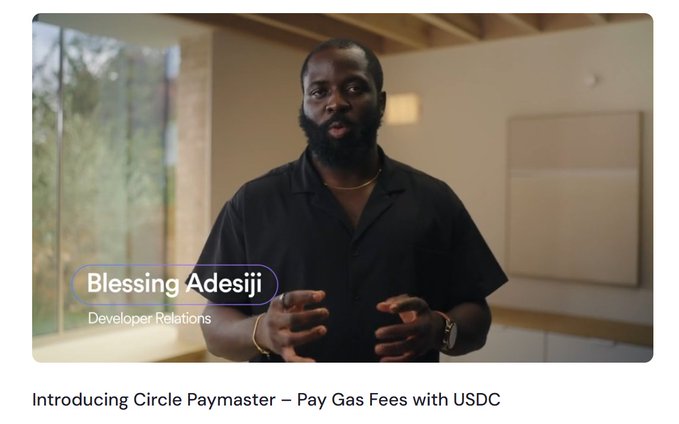 The image shows a man standing in front of a window with his hands outstretched as if he's giving a speech or presentation. The text at the bottom of the image reads "incase you don' t know - with Circle Paymaster, you absolutely can firstly, what's circle paymaster ? Circle Paymaster is an on chain service, which is a smart contract system, that lets users pay gas fees in USDC instead of Chain' s native token was watching this episode of".